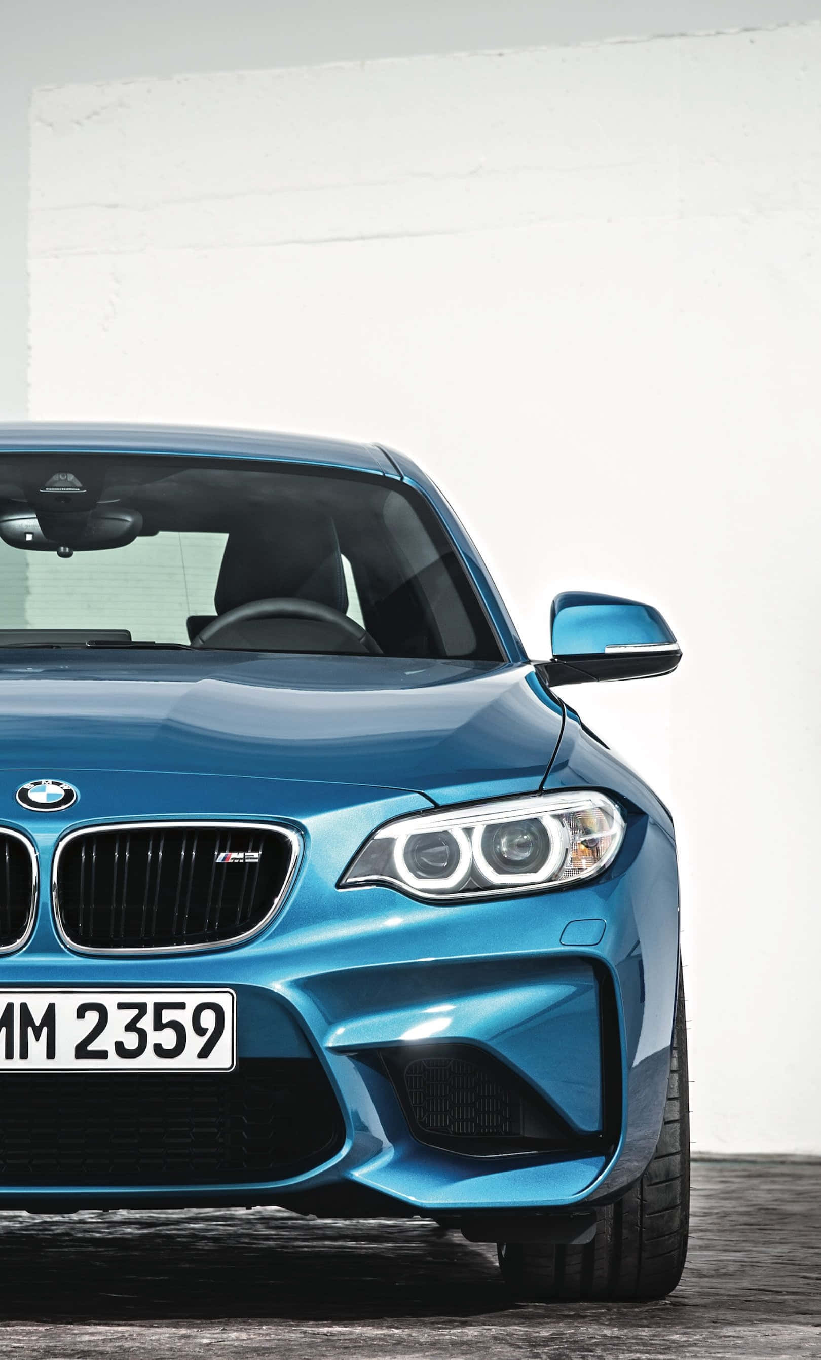 اسٹائلش BMW آئی فون وال پیپر جس میں خوبصورت اسپورٹس کار اور لوگو ہے وال پیپر