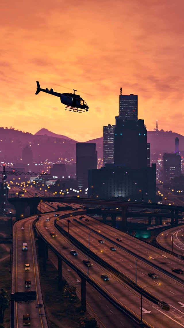 GTA کا پس منظر جس میں لاس سینٹوس پر ہیلی کاپٹر اڑ رہا ہے وال پیپر