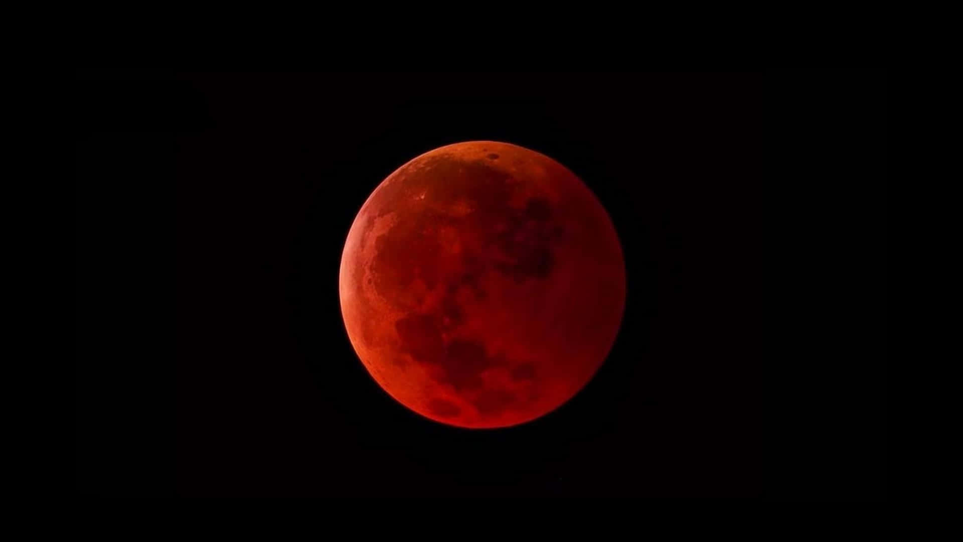 آسمان میں ایک سرخ چاند نظر آ رہا ہے وال پیپر