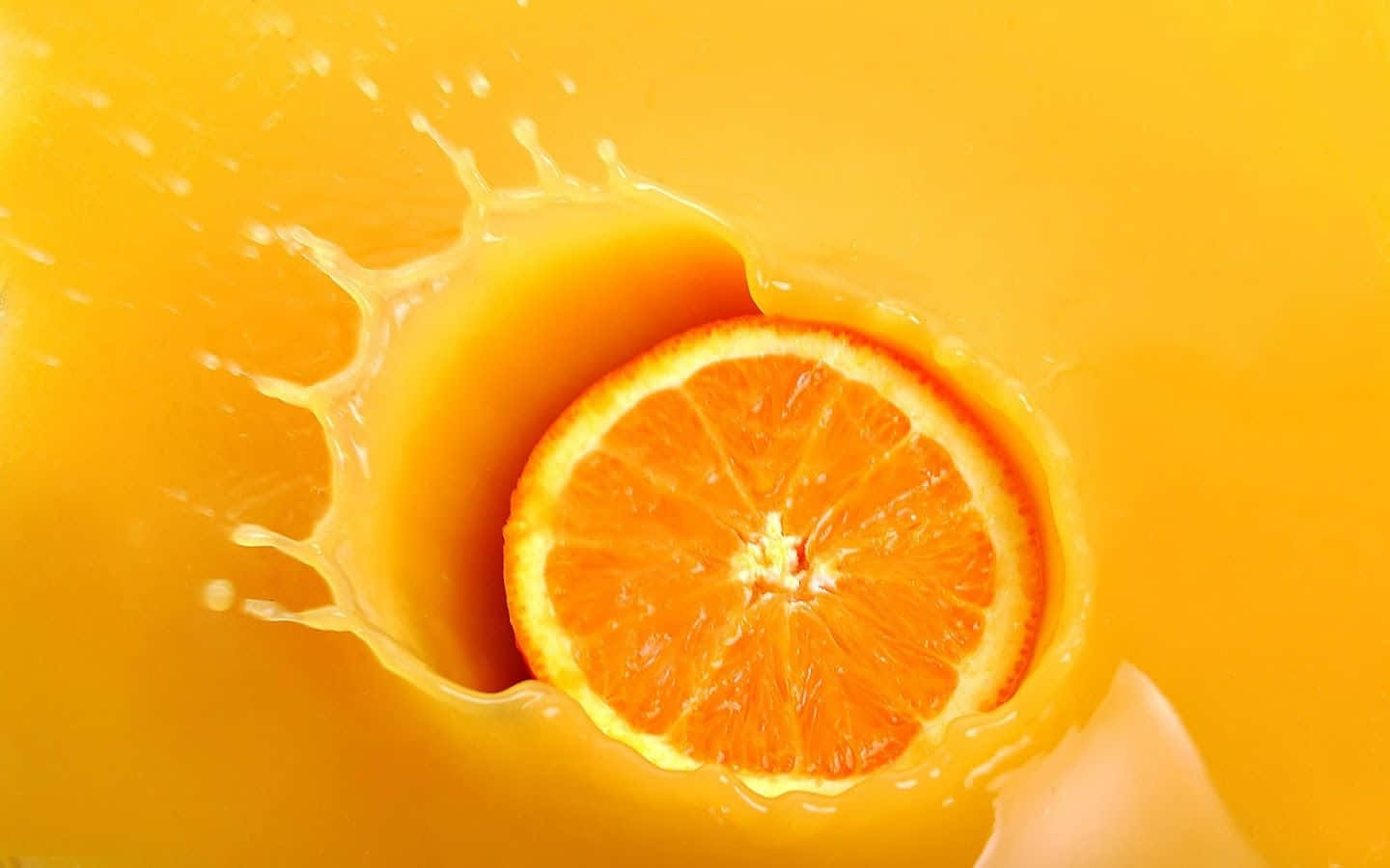 نارنجی چھڑکاؤ اور سنتری کے رس کا پس منظر وال پیپر