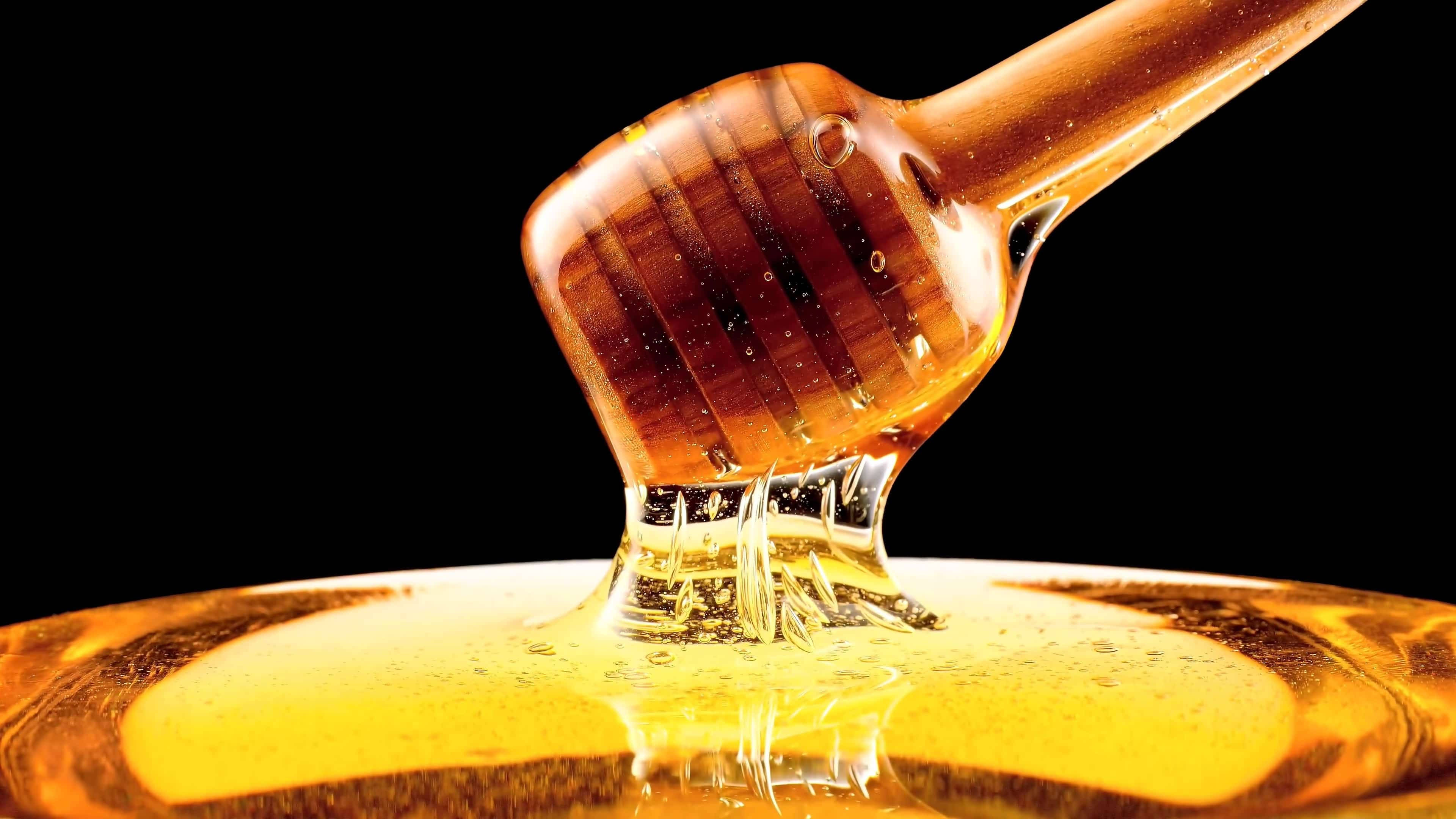 چپچپا اور لیس دار شہد کا ڈپر وال پیپر