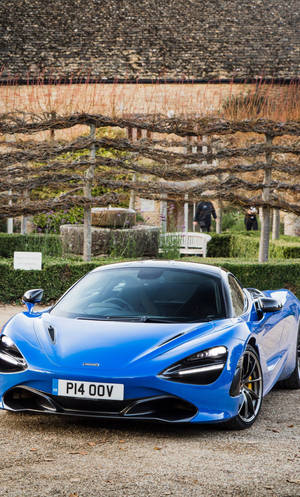 میک لیرن 720S نیلی گاڑی باغ میں فون — نیلا جمالیاتی متحرک تصویر وال پیپر